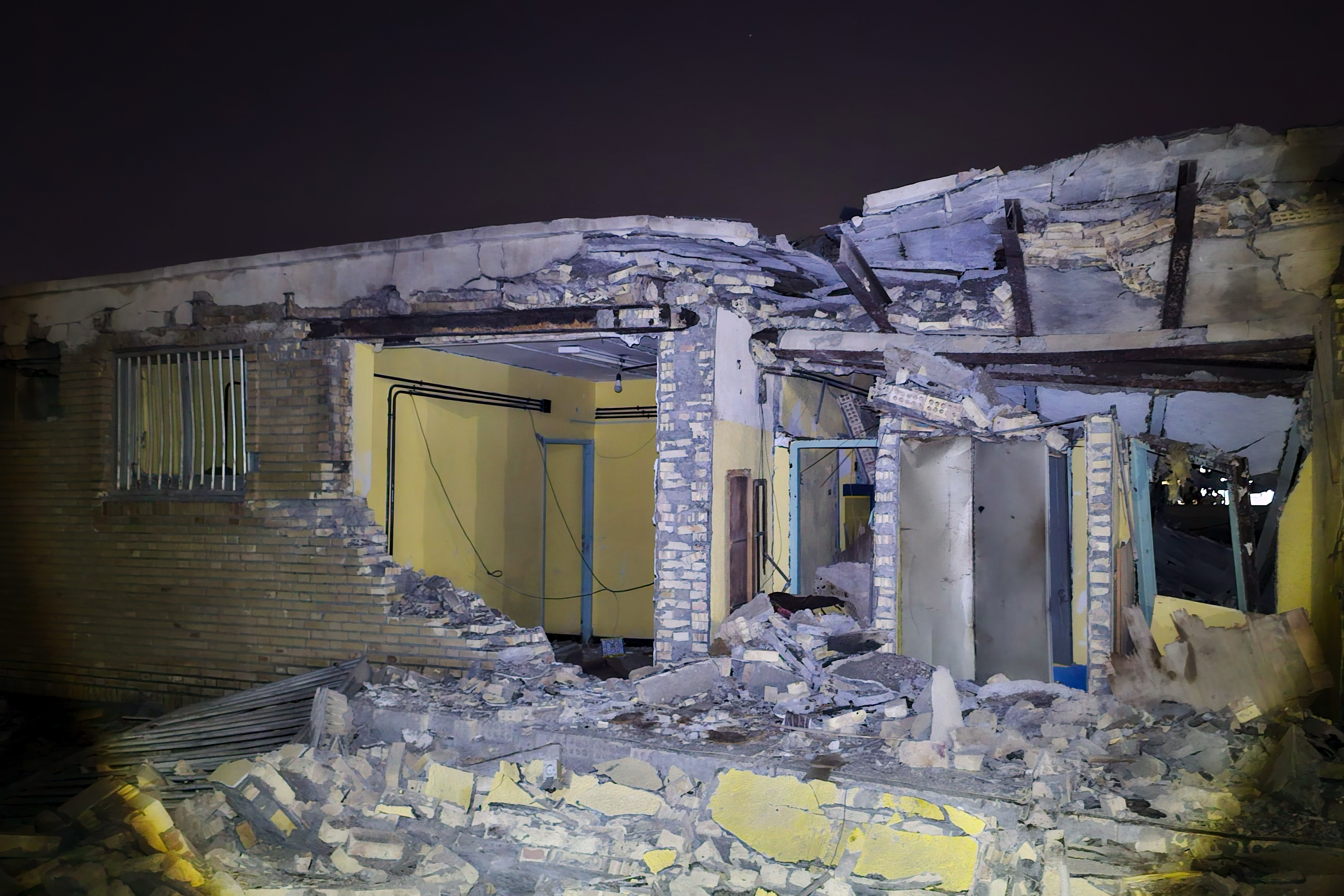 Damage is seen at a building that Iranian media said was hit in a U.S. strike in Kuhestak, southern Iran, early Wednesday.